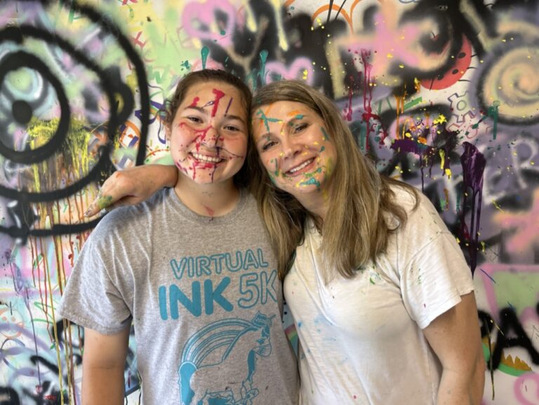 2 family members with paint on their face